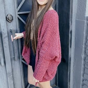 Dolman sleeves, front pockets, soft material!  Never been worn.